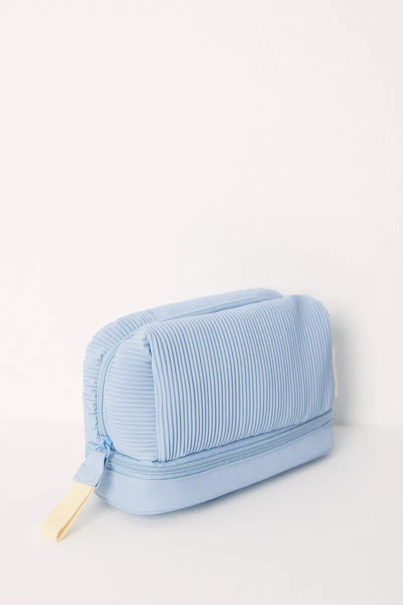 Medium blue rubberized toiletry bag