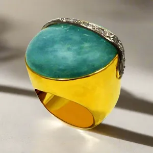 Ring in 18k Gold with a 50 ct. aqua marin cabochon and diamonds (B-16)